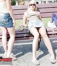 Pretty upskirt girls soak in the sun
