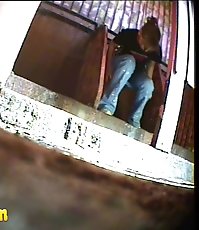 Pissing girl get busted and filmed in public loo