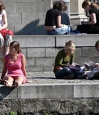Busty chick voyeured in public. Up skirt sitting